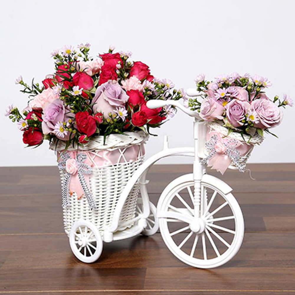 Purple & Pink Flowers In Cycle Basket Purple & Pink Flowers In Cycle Basket