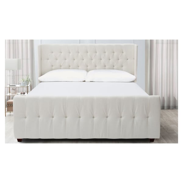White upholstered shop queen bed